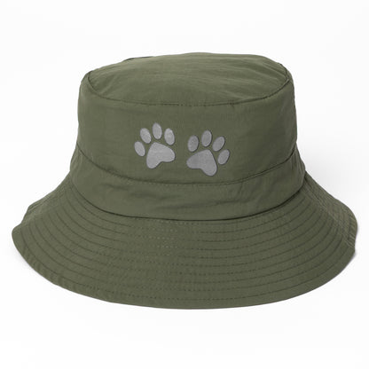Green bucket hat with paw prints on a white background
