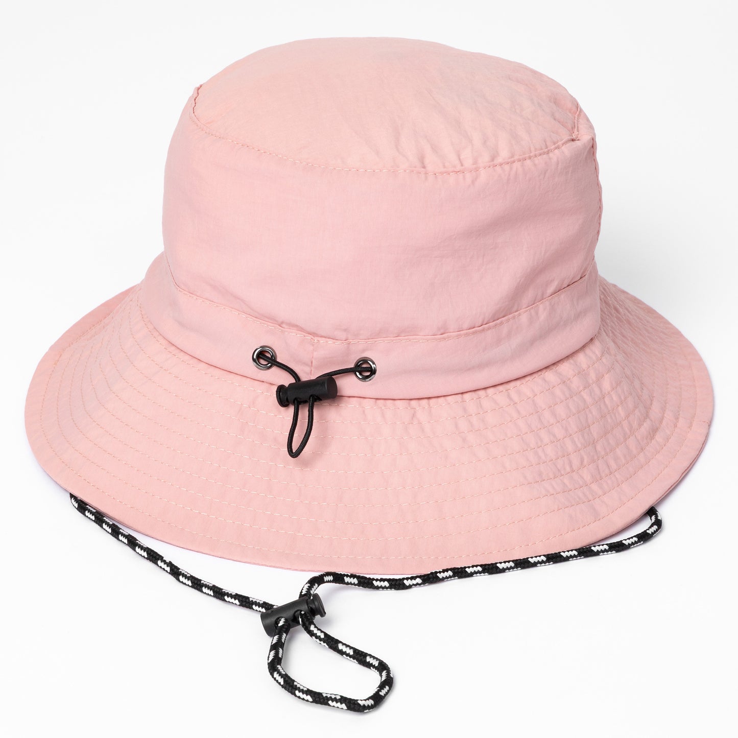 Pink bucket hat with a black drawstring on a white background