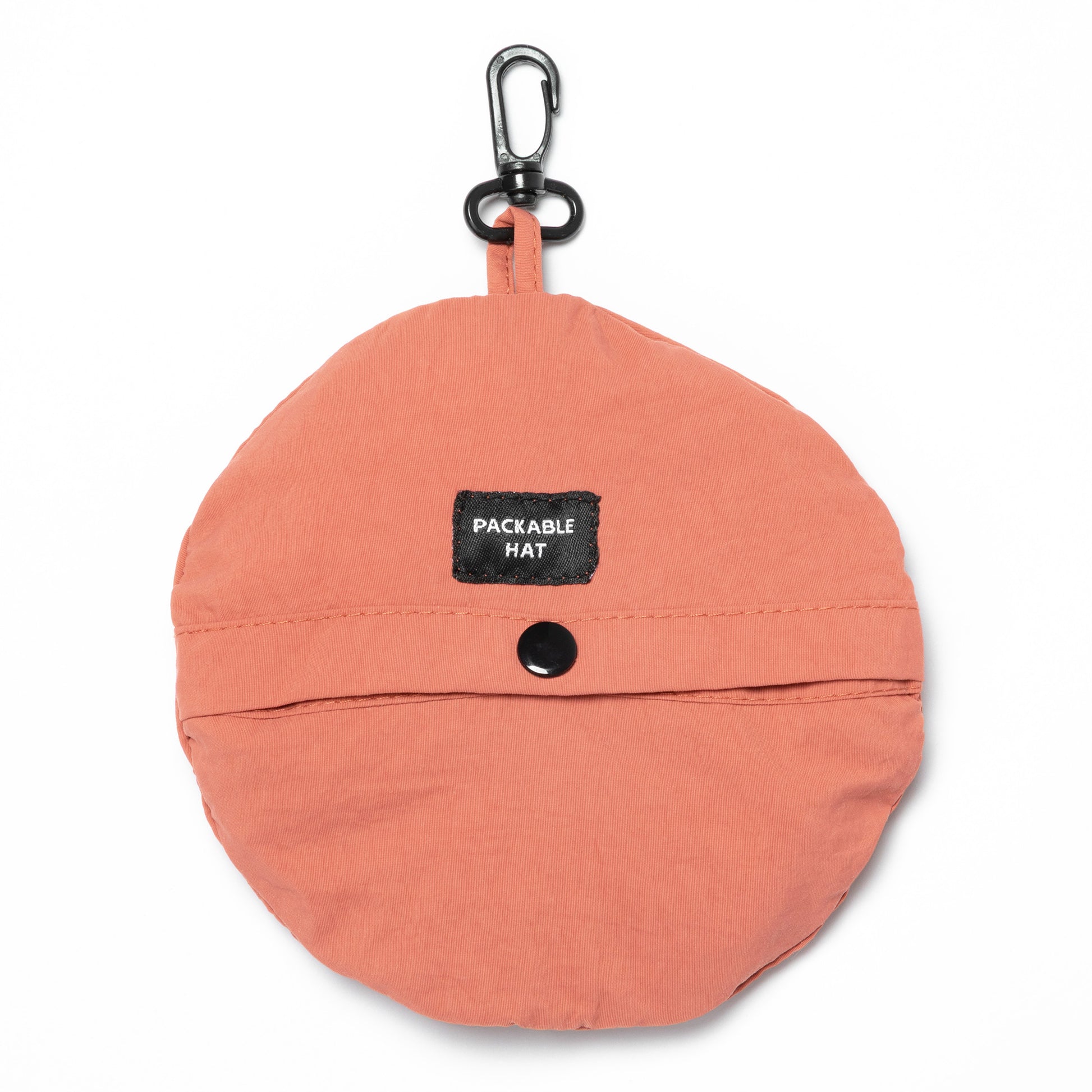Coral color packable hat with a carabiner on a white background
