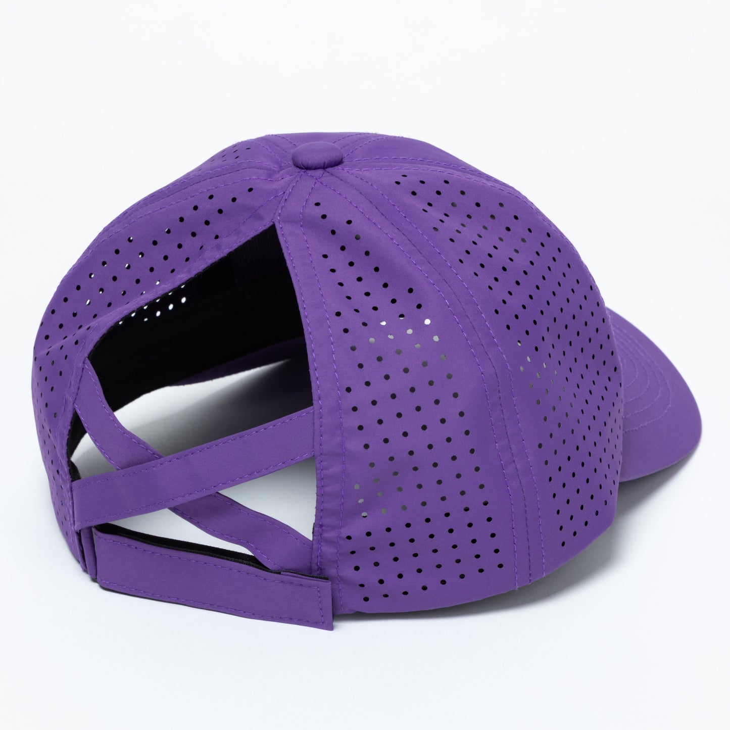 Purple baseball cap with perforated design on a white background