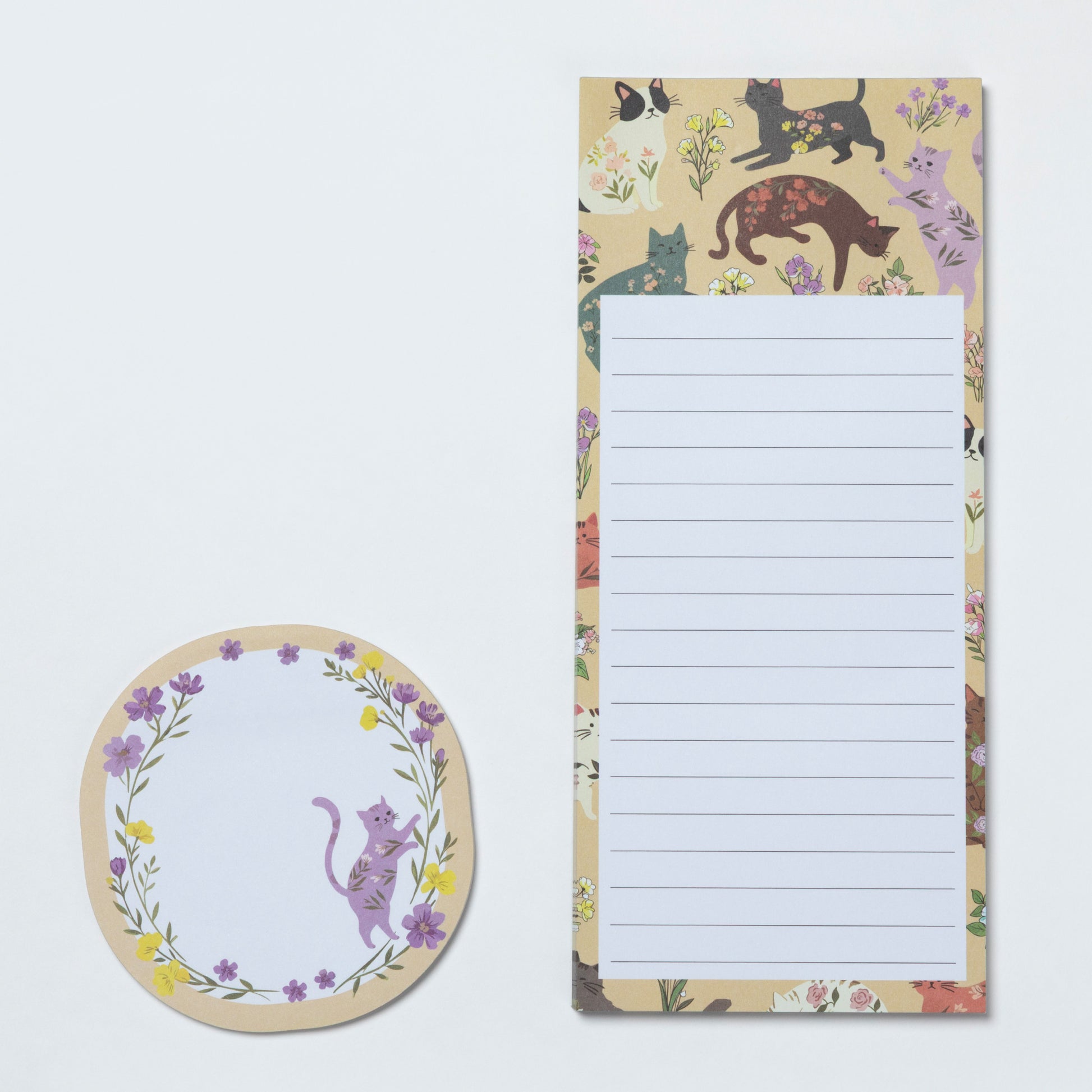 Notepad with cat and floral design on a white background