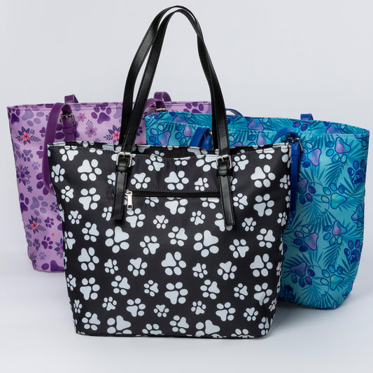 Three handbags with different patterns on a light gray background