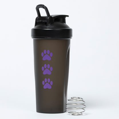 Black shaker bottle with purple paw prints on a white background