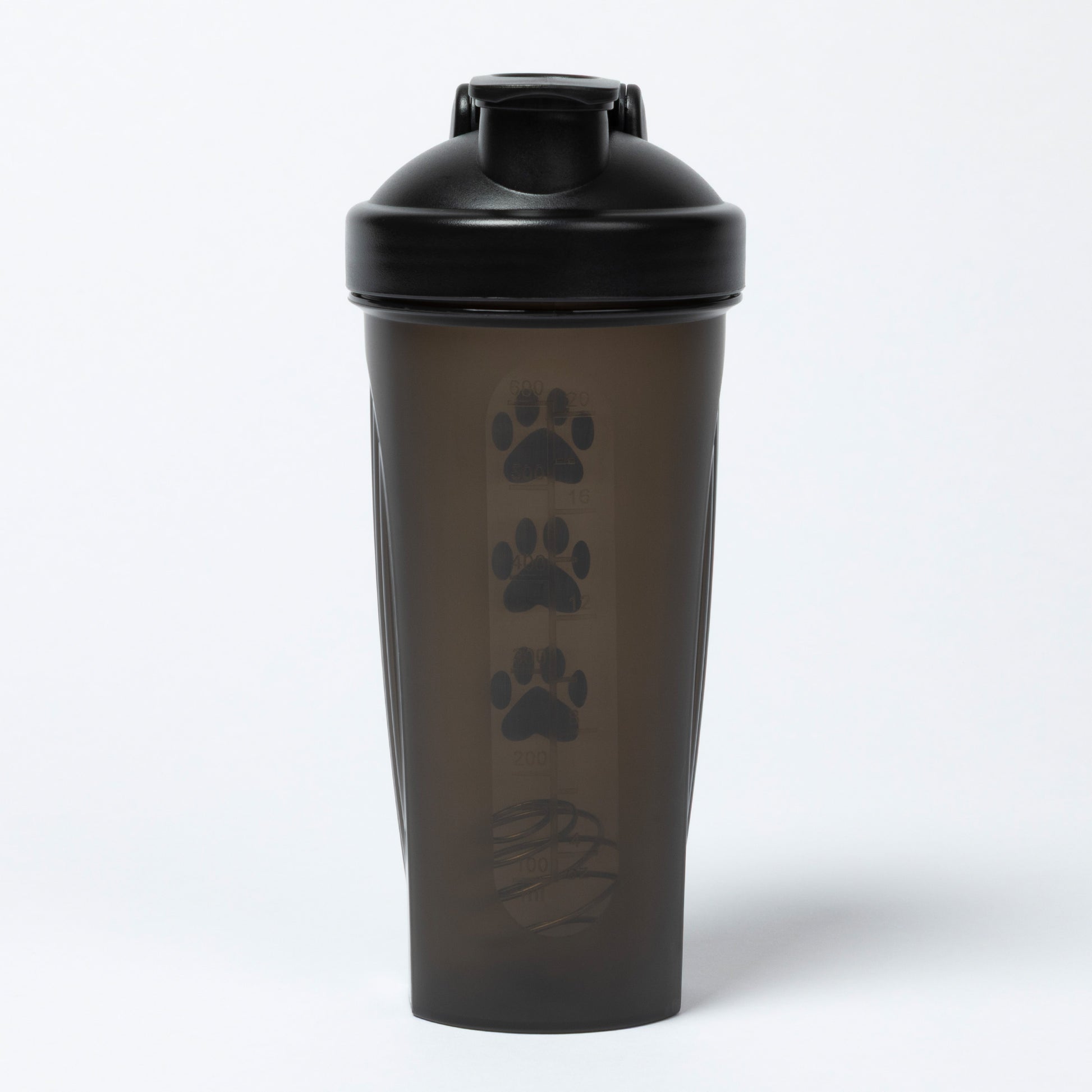Black shaker bottle with paw prints on a white background