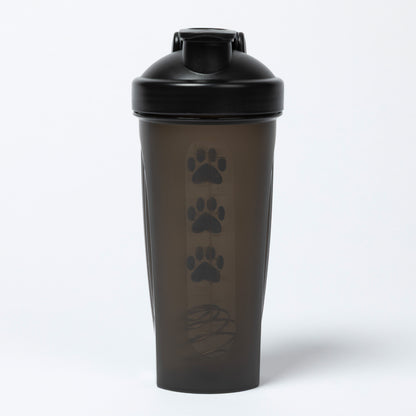 Black shaker bottle with paw prints on a white background