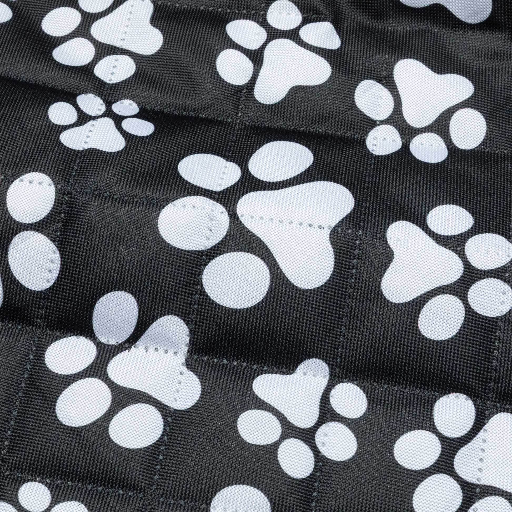 Black fabric quilted car seat cover with white paw print pattern
