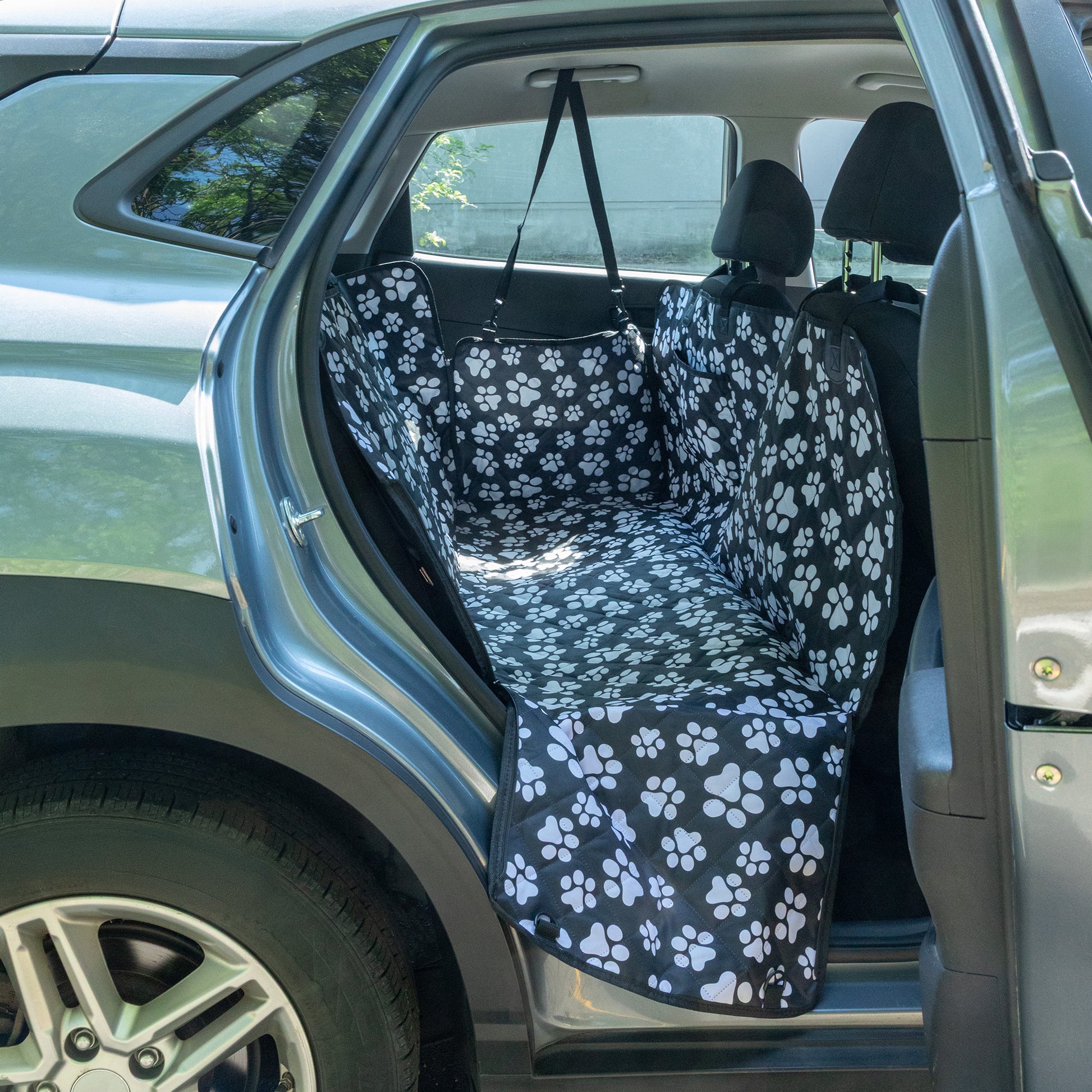 Car seat cover with paw pattern inside a vehicle
