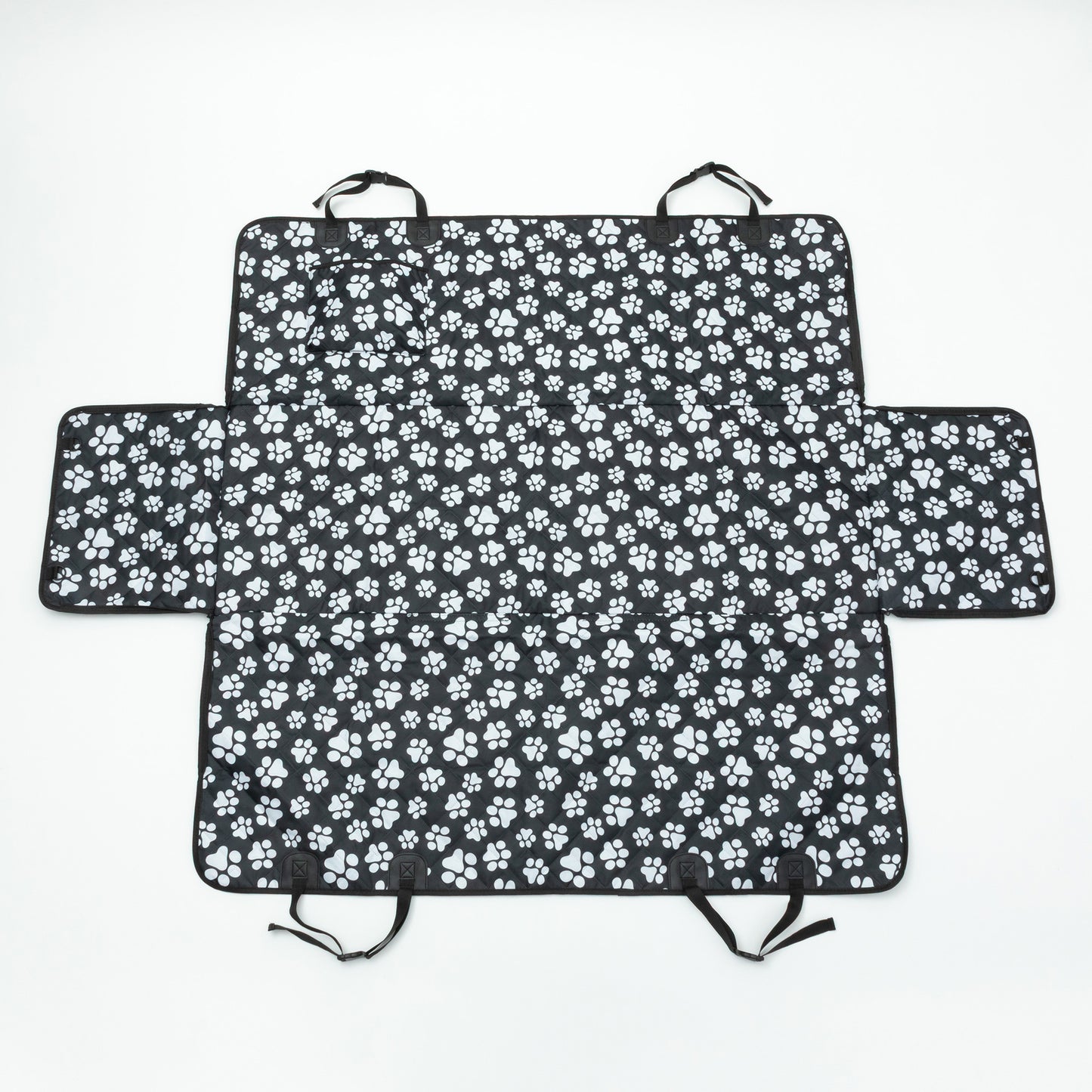 Black car seat cover with white paw prints on a white background