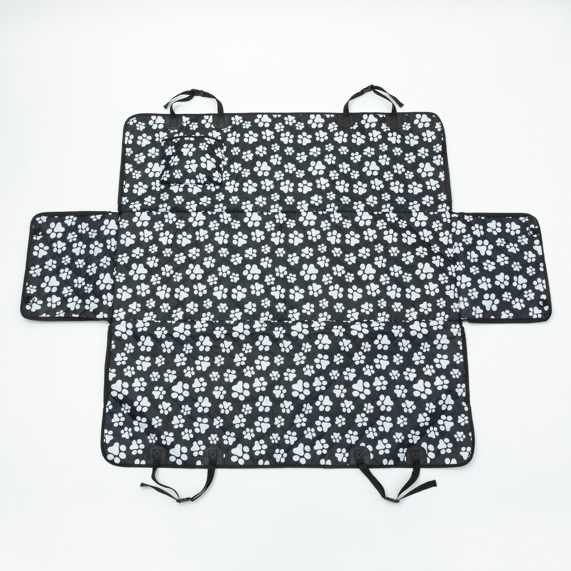 Black car seat cover with white paw prints on a white background