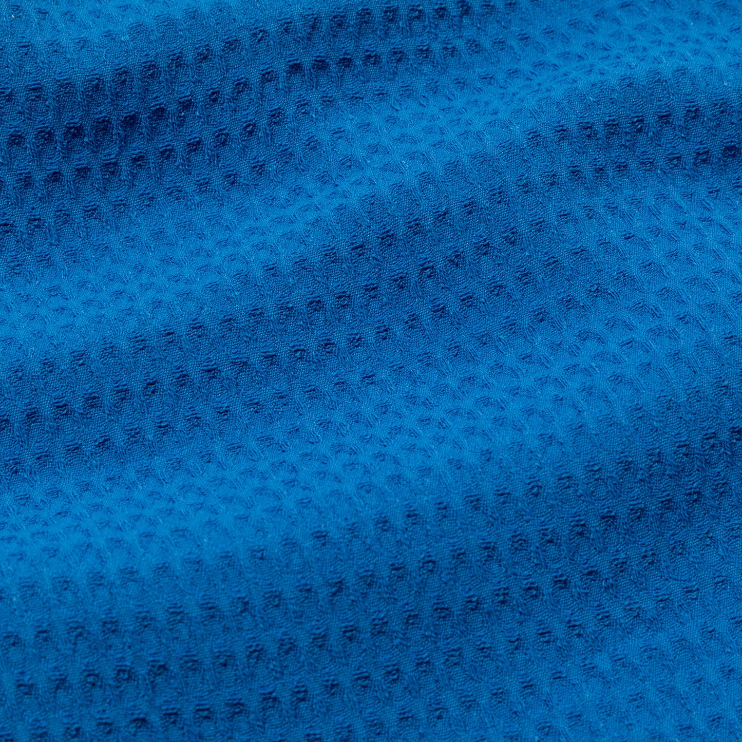 Close-up of blue waffle weave textured fabric