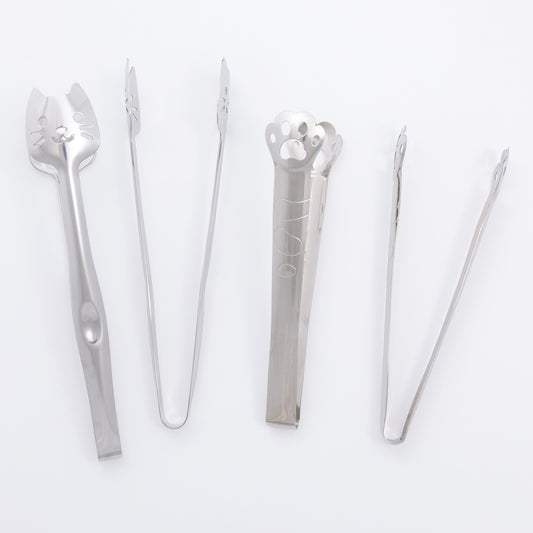 Set of silver kitchen tongs on a white background