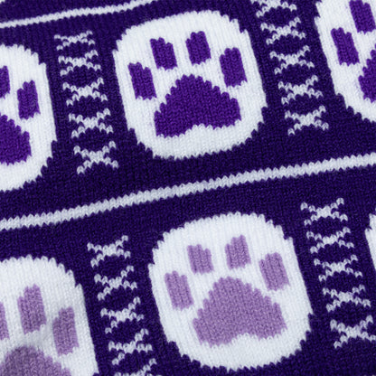 Close-up of purple and white fabric with paw print pattern