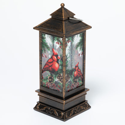 Decorative lantern with cardinals and winter scene on a white background