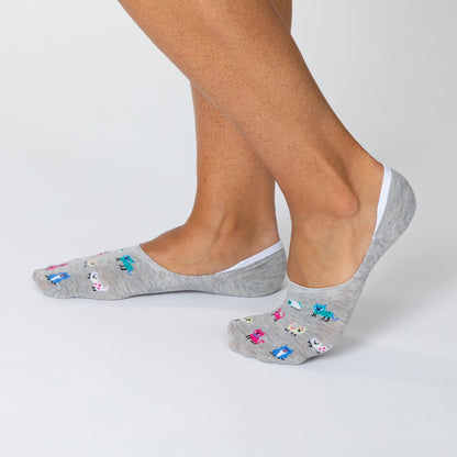 Gray no-show socks with colorful designs worn by a person on a light gray background