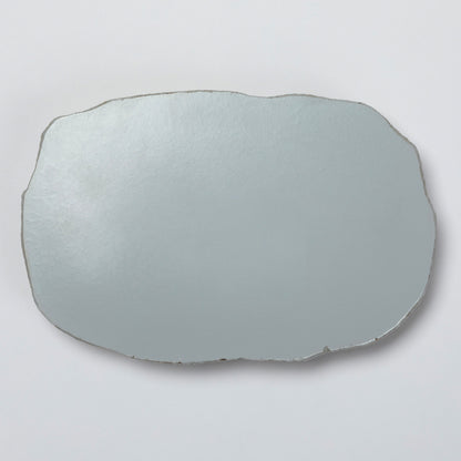 The back of the polyresin garden stone on a light gray background