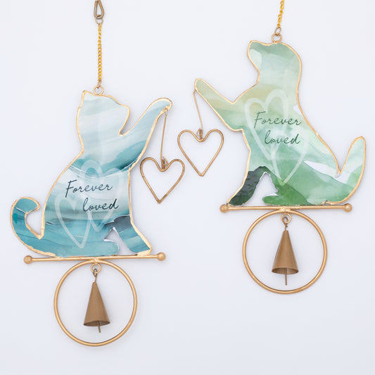 Decorative hanging wind chimes with cat and dog shapes, 'Forever loved' text, and gold accents on a white background.