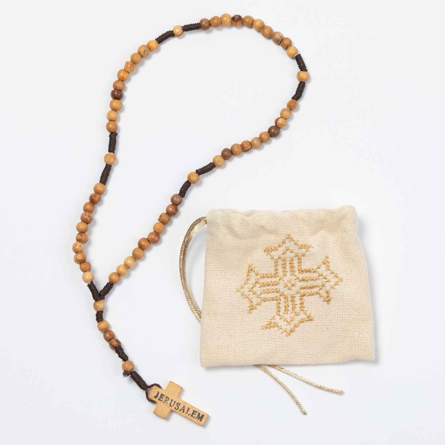 Wooden beaded necklace with 'Jerusalem' tag and a decorative pouch on a white background