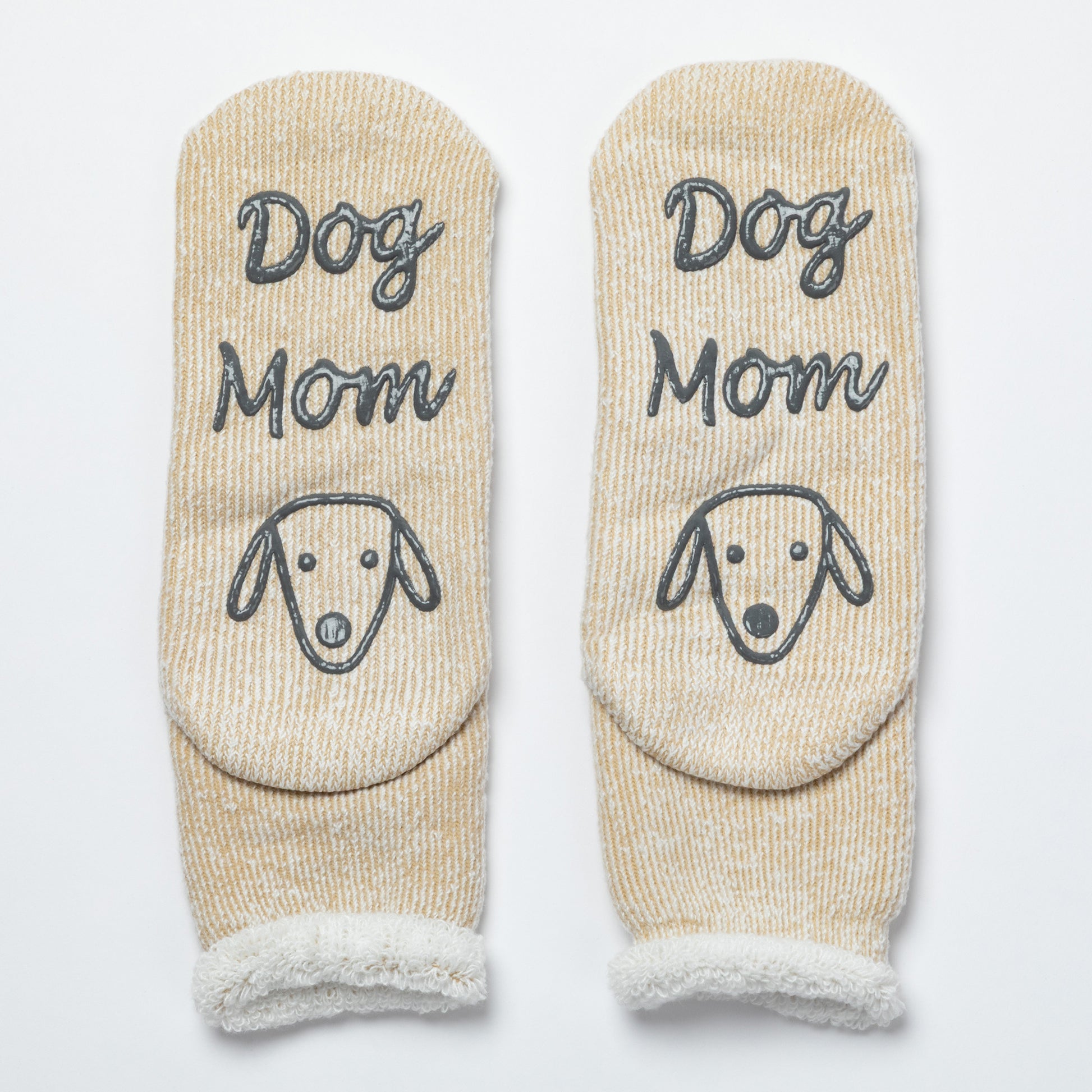 Pair of beige socks with 'Dog Mom' text and dog face design on a white background