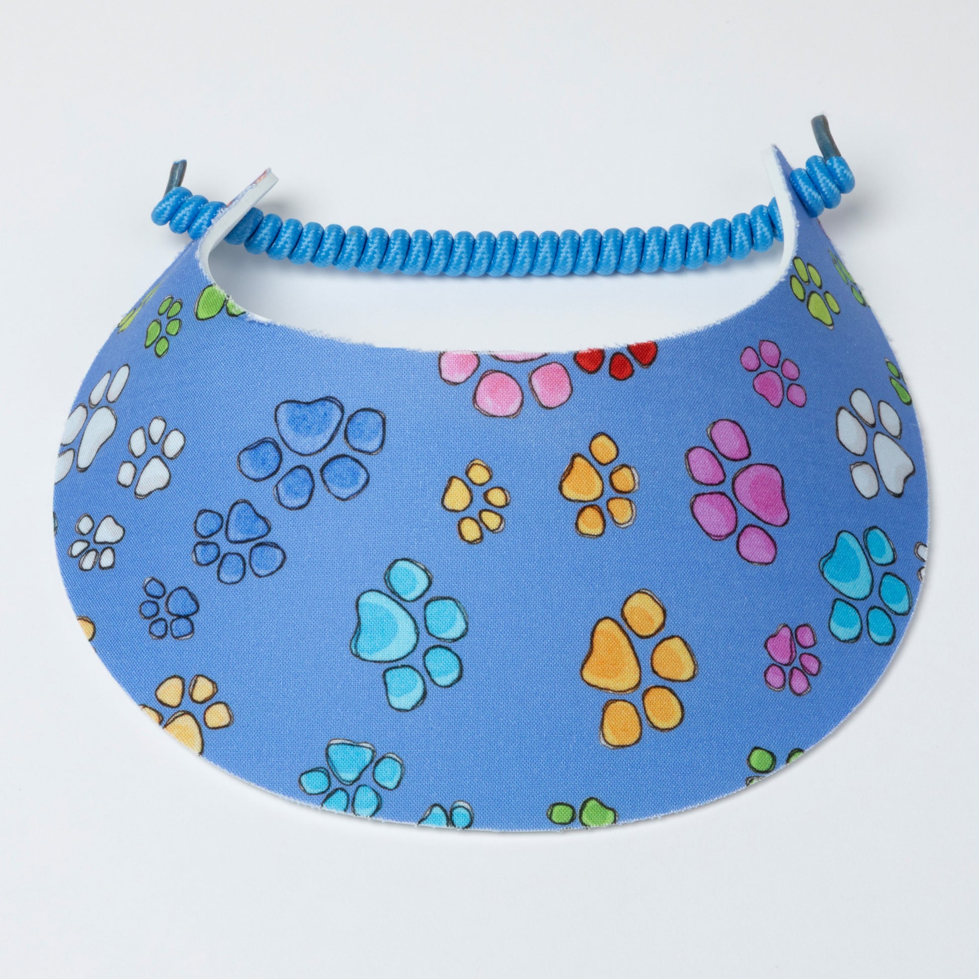 Blue visor with colorful paw prints on a white background