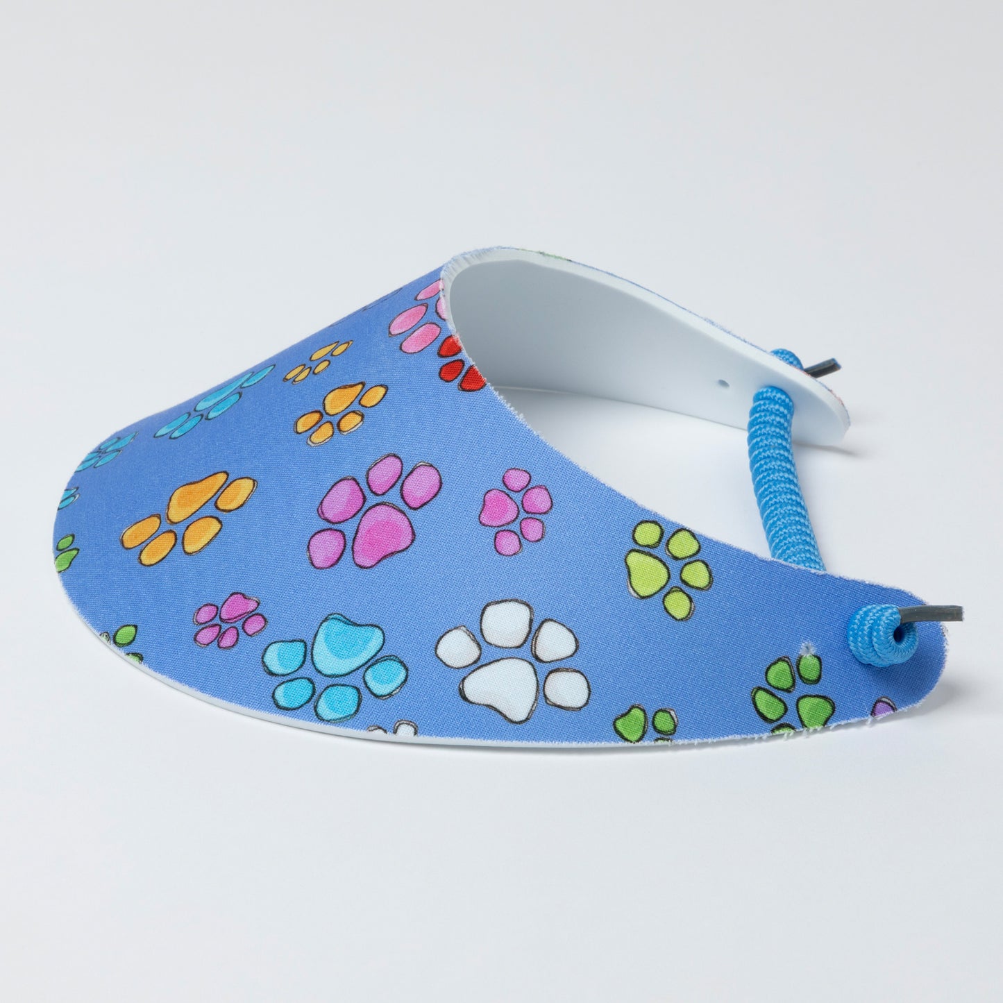 Blue foam visor with colorful paw prints on a white background