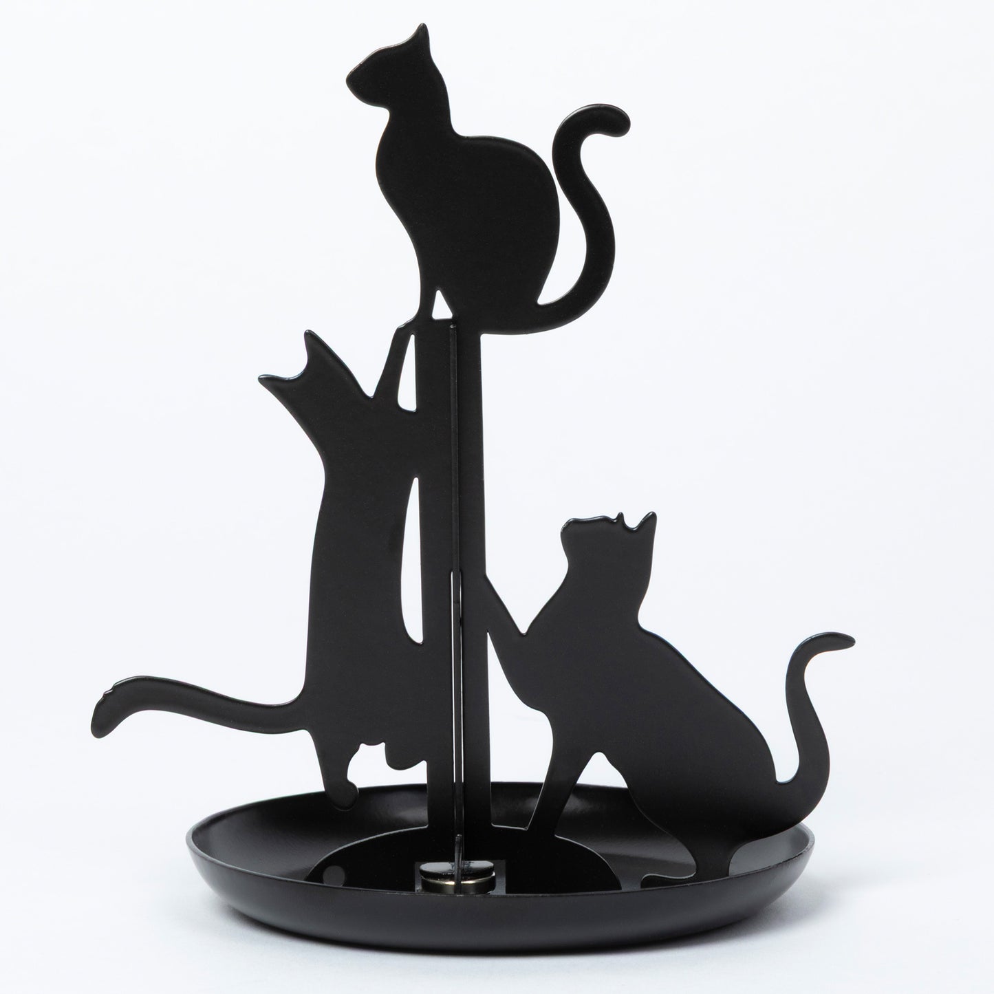 Black metal cat-shaped jewelry holder with three cat silhouettes on a round base, photographed against a plain white background.