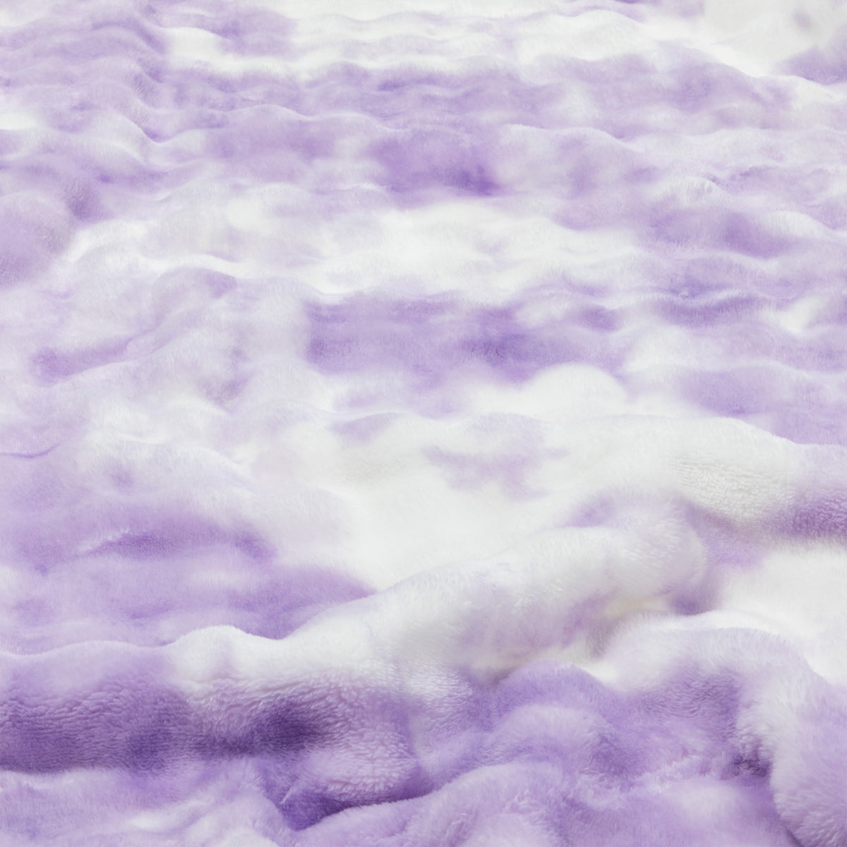 Lavender and white fluffy textured blanket with a soft plush surface.