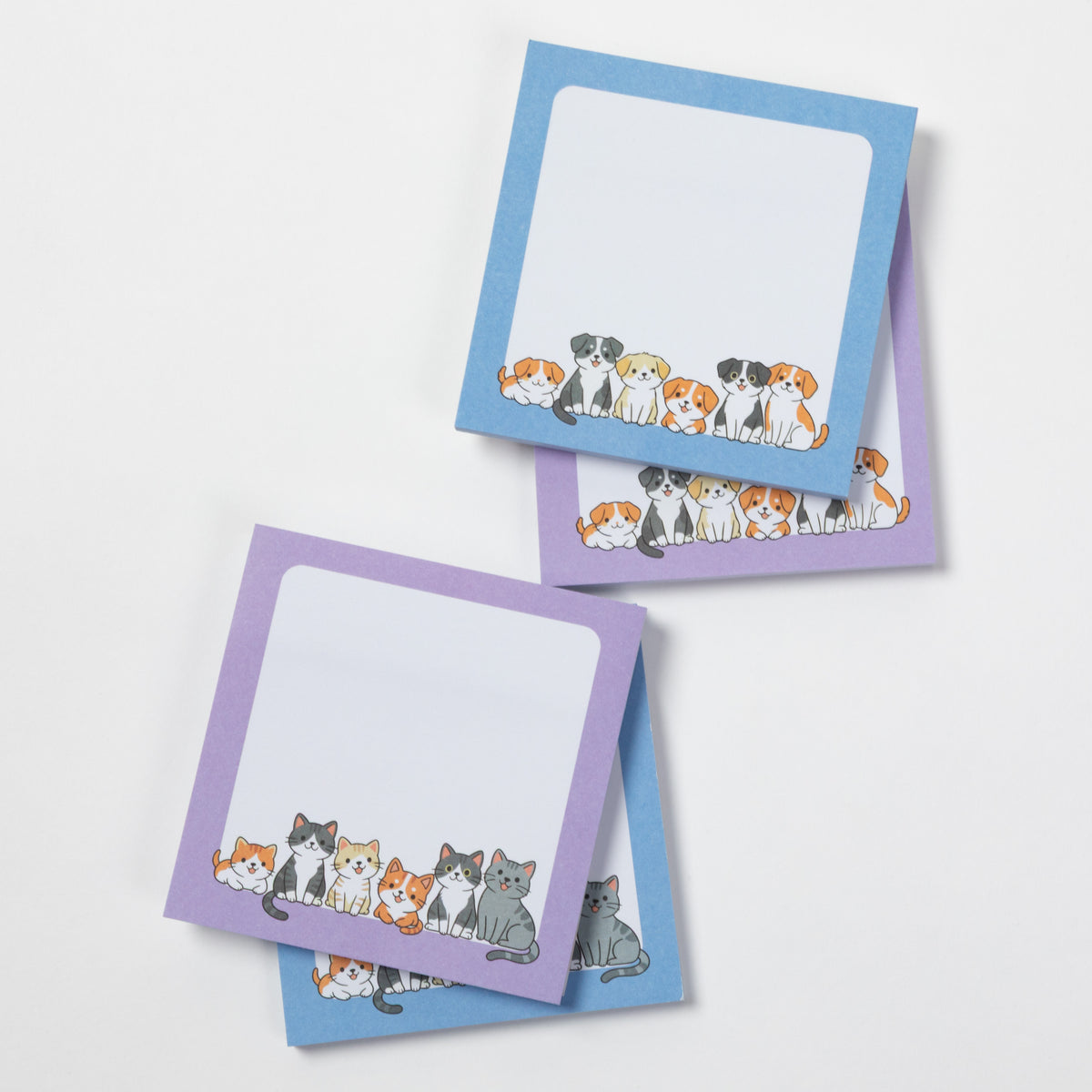 Two small notepad sheets with rounded corners, one with a lavender border and one with a sky blue border, each printed with a row of illustrated pets at the bottom. The notepads are arranged on a clean white background.