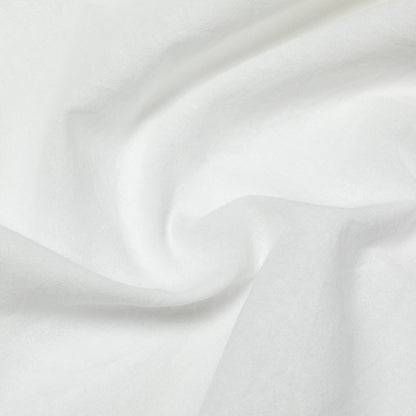Close-up of white dish towel with subtle texture