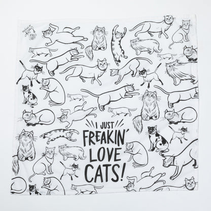 White towel with black line art of cats and text 'I just freakin' love cats!' on a white background