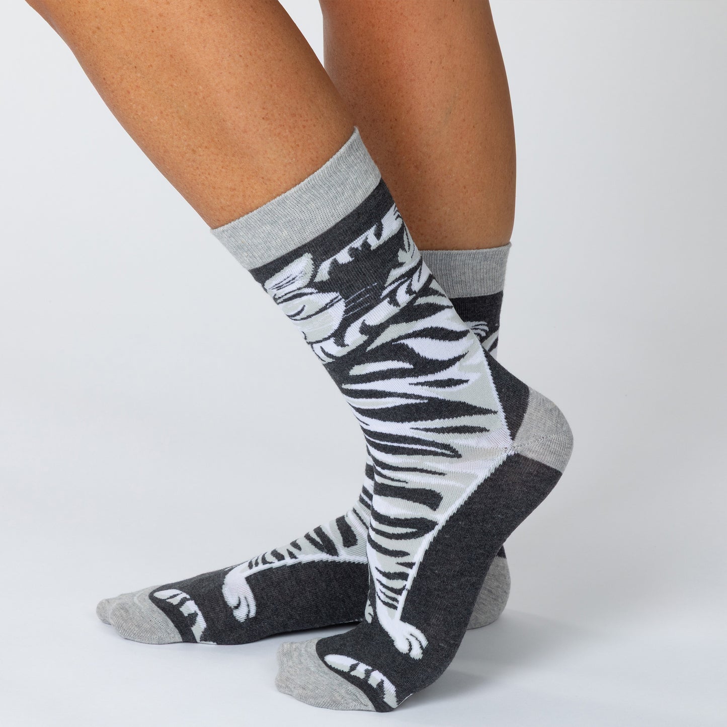 Gray and black striped cat socks with text about cat cuddling.