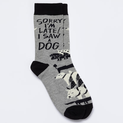 Gray sock with black text and dog illustrations on a white background