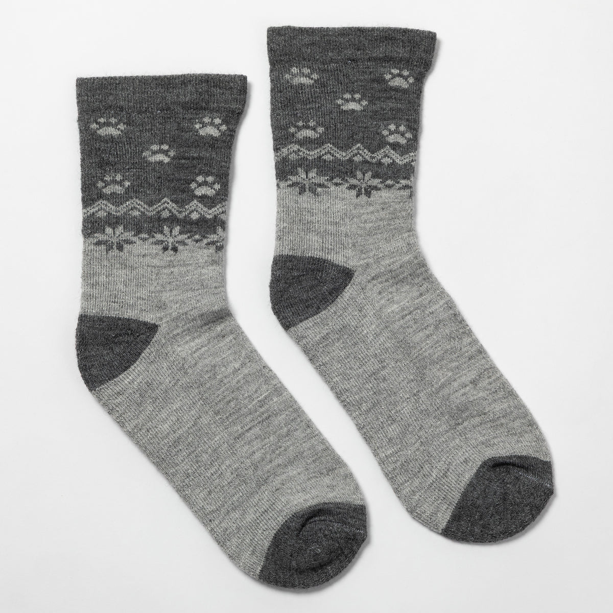 A pair of crew socks in heather gray with a darker gray patterned upper section featuring paw prints and snowflake motifs, shown on a plain white background.