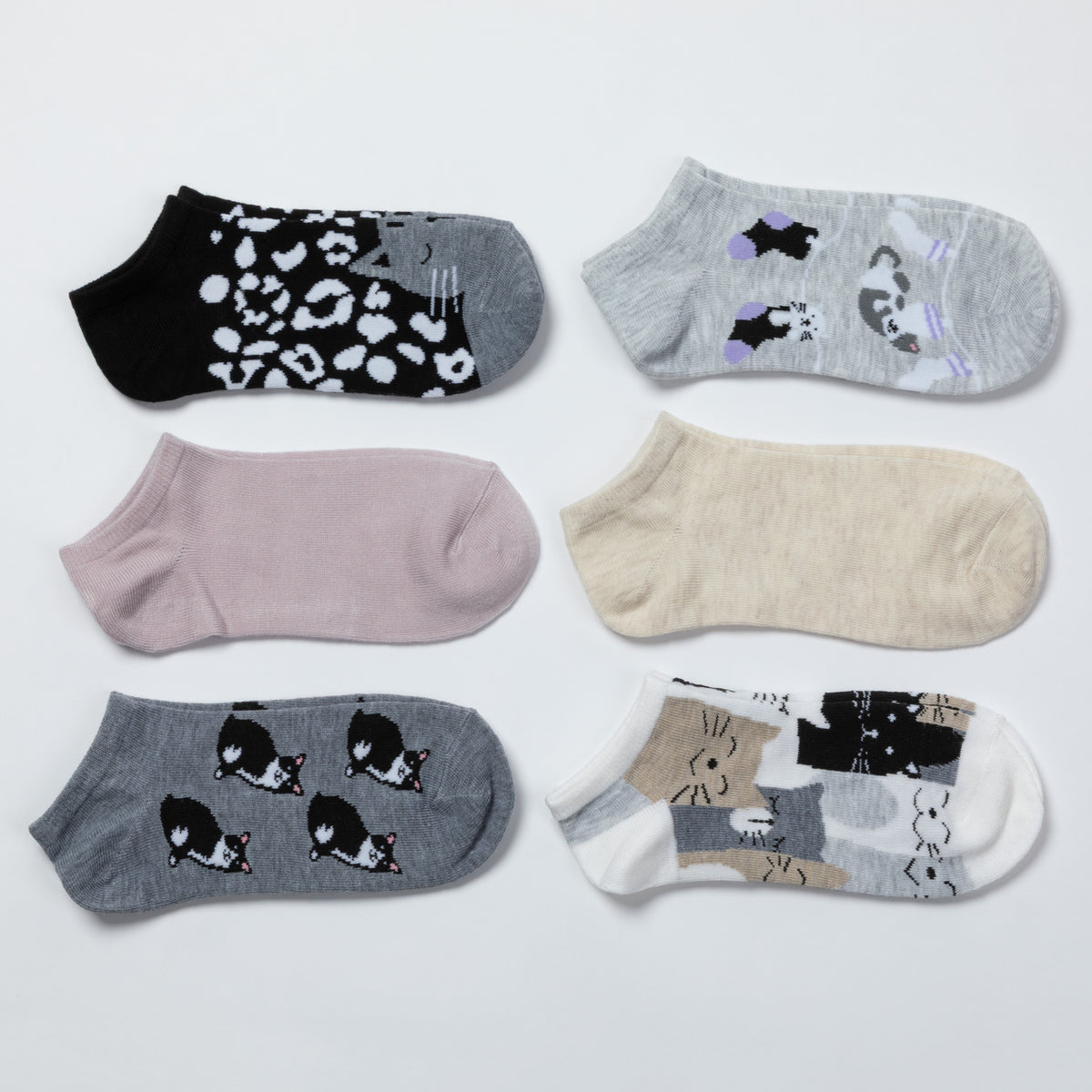 Six pairs of low-cut ankle socks arranged in a grid on a light gray background. 