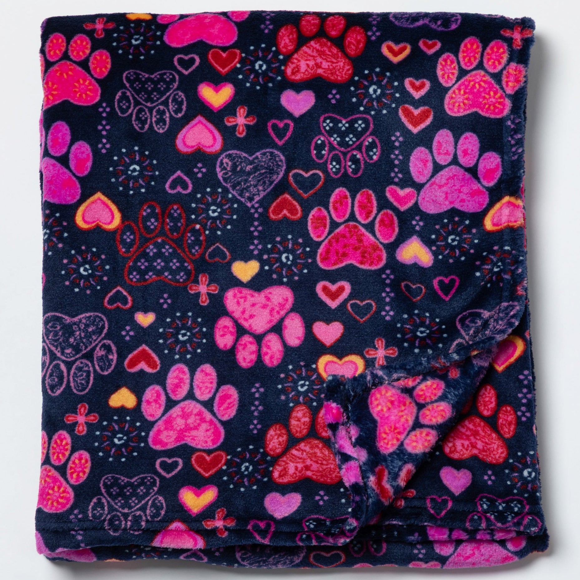 Navy blanket with pink paw prints and hearts on a white background