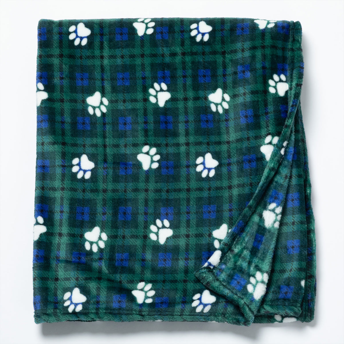 A folded green plaid blanket with white paw prints and small blue square accents, photographed on a clean white background.