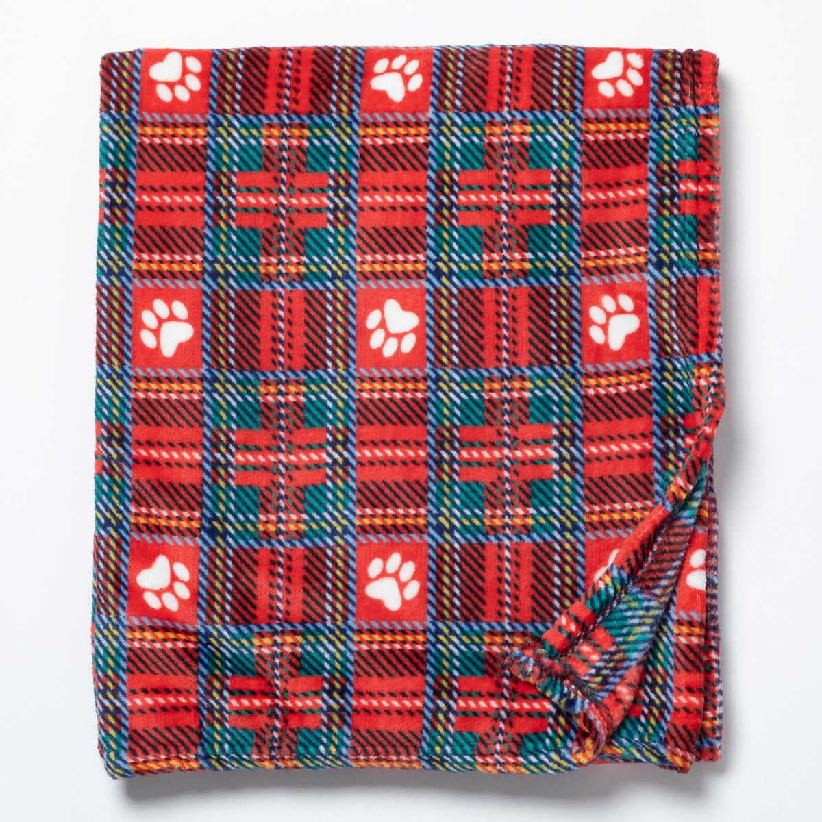 A folded plaid blanket with a red, green, and orange tartan pattern, featuring white paw print motifs on a light gray background.
