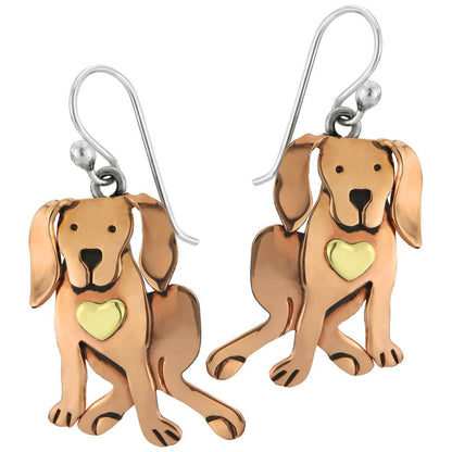 Dog-shaped copper earrings with heart details on a white background