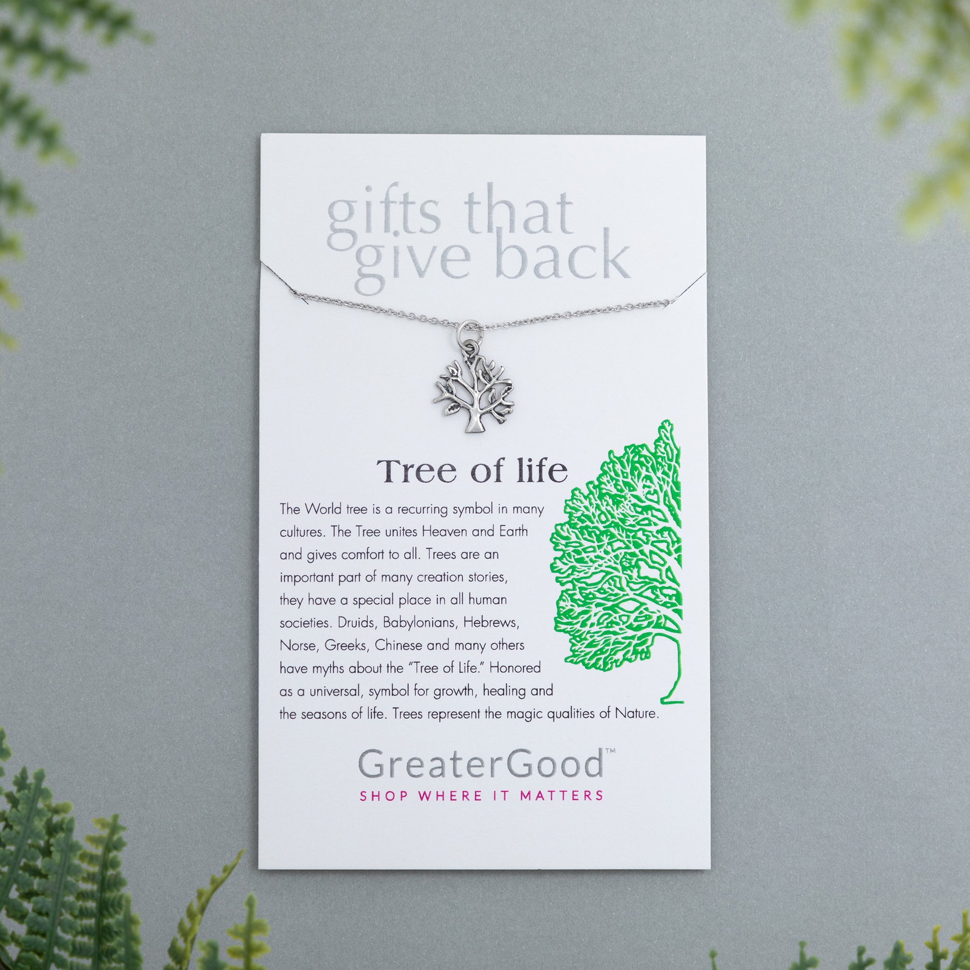 Tree of life necklace on a GreaterGood branded card with green leaf illustration