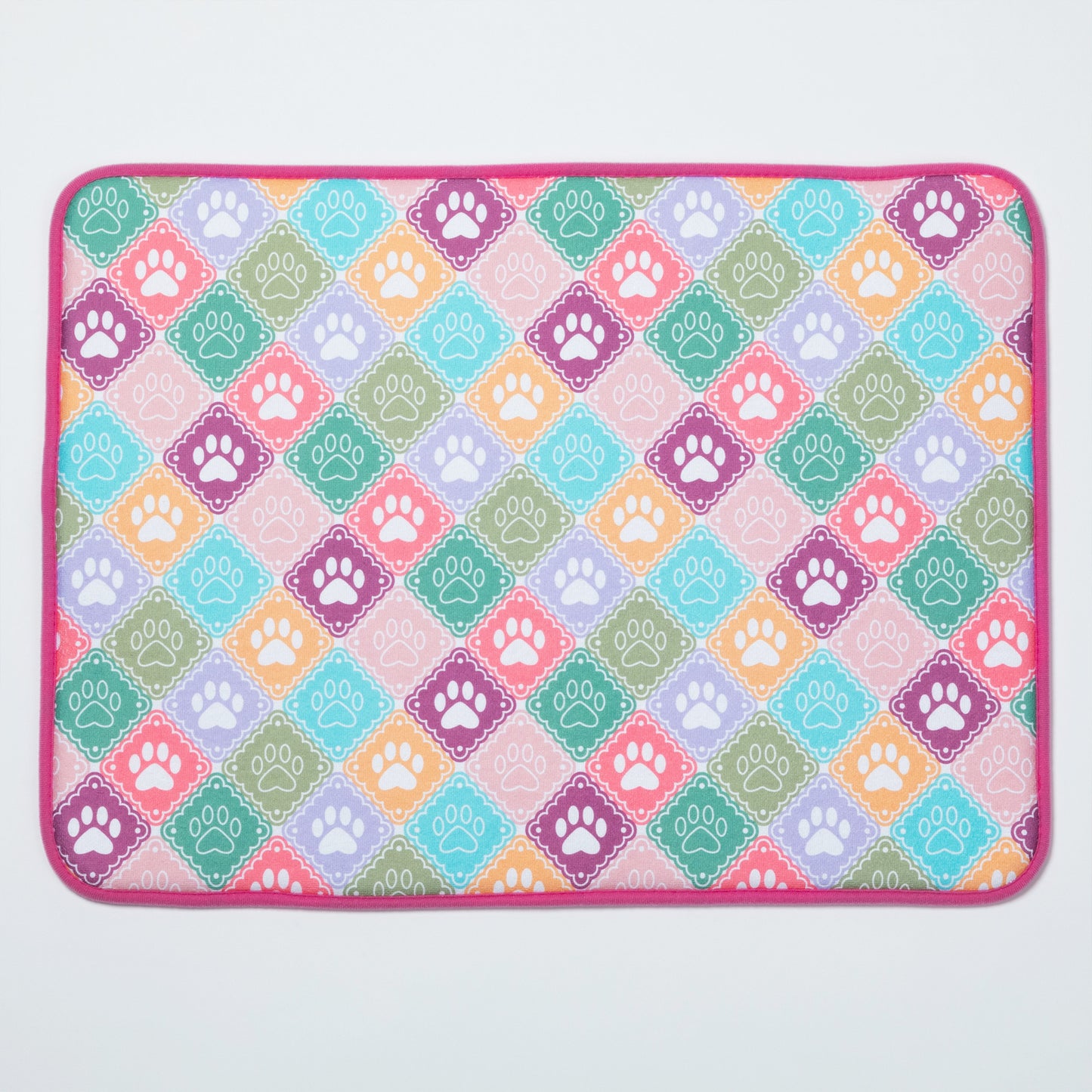 Colorful mat with paw print pattern on a white background