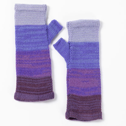 a pair of alpaca fingerless mittens in shades of purple made from alpaca wool on a white background