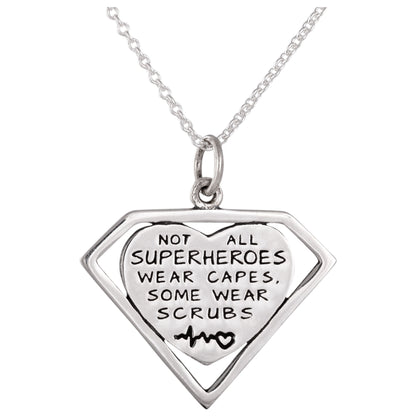 Silver necklace with a superhero-themed pendant and a heart, on a white background