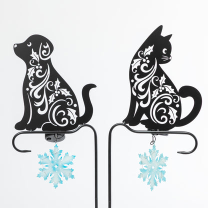Decorative metal cat and dog silhouettes with floral patterns on a white background.