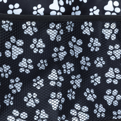 Close up of mesh side pocket on a paw printed car trunk organizer.