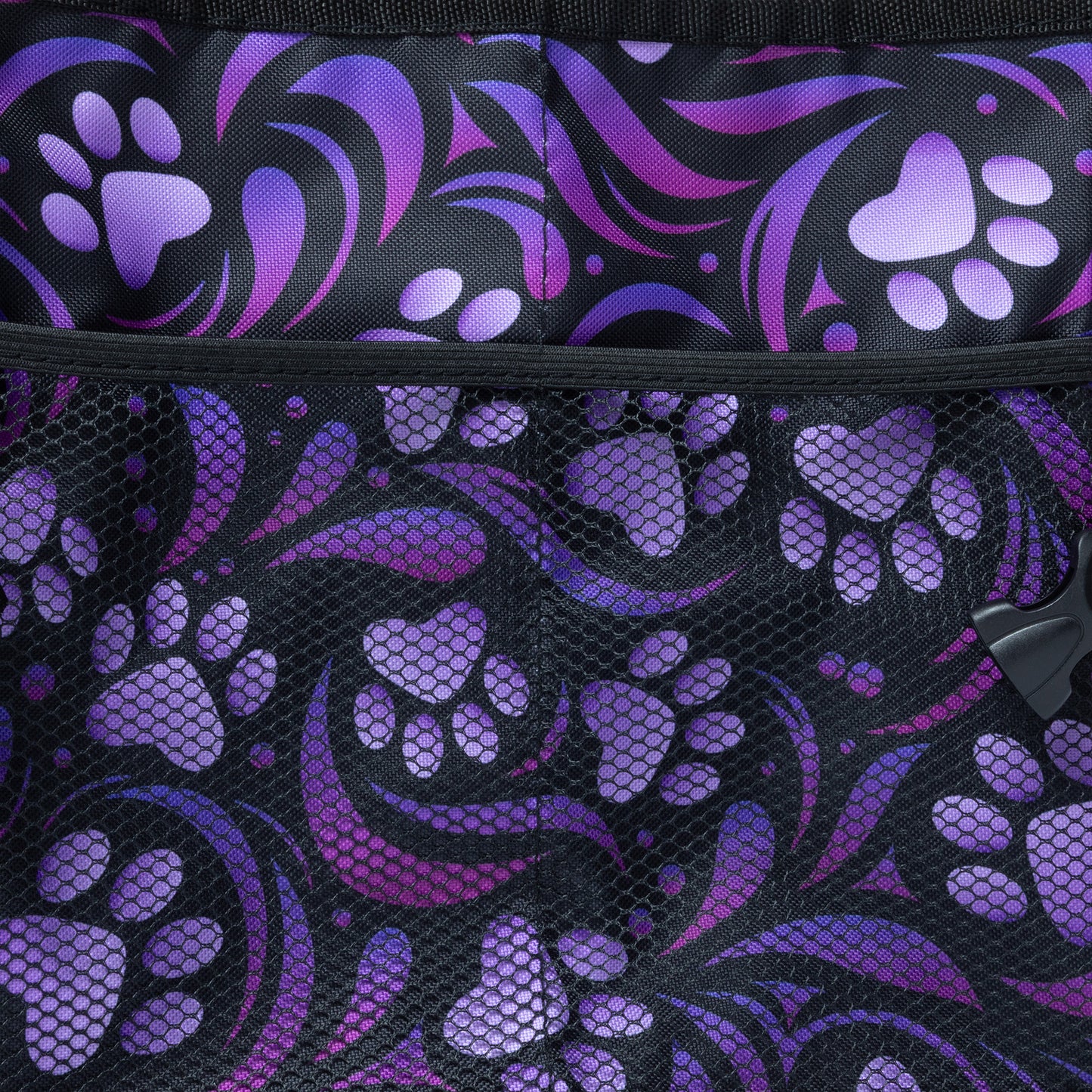 Close up of purple paw print pattern on collapsible car trunk organizer, with the mesh side pocket.
