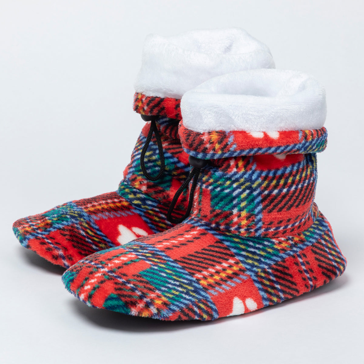 A pair of plush slipper boots with a festive red, green, and blue tartan plaid pattern, featuring a thick white faux-fur trim and black drawstrings, set against a plain light gray background.