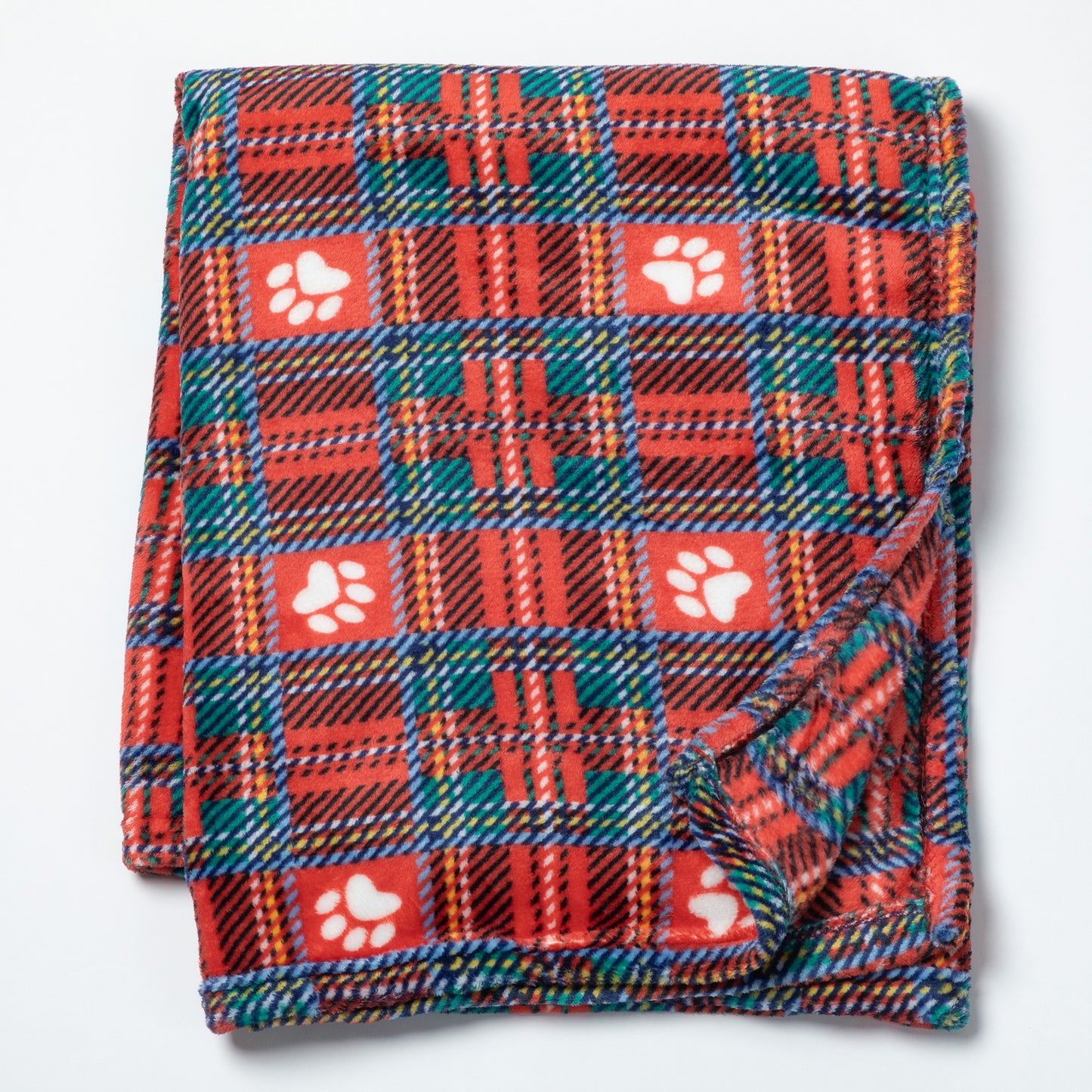 A folded fleece blanket featuring a red, green, and orange plaid pattern with white paw print motifs, displayed on a clean white background.