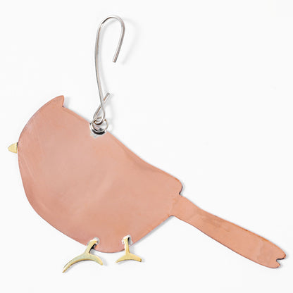 Back of a copper cardinal ornament on a white background.