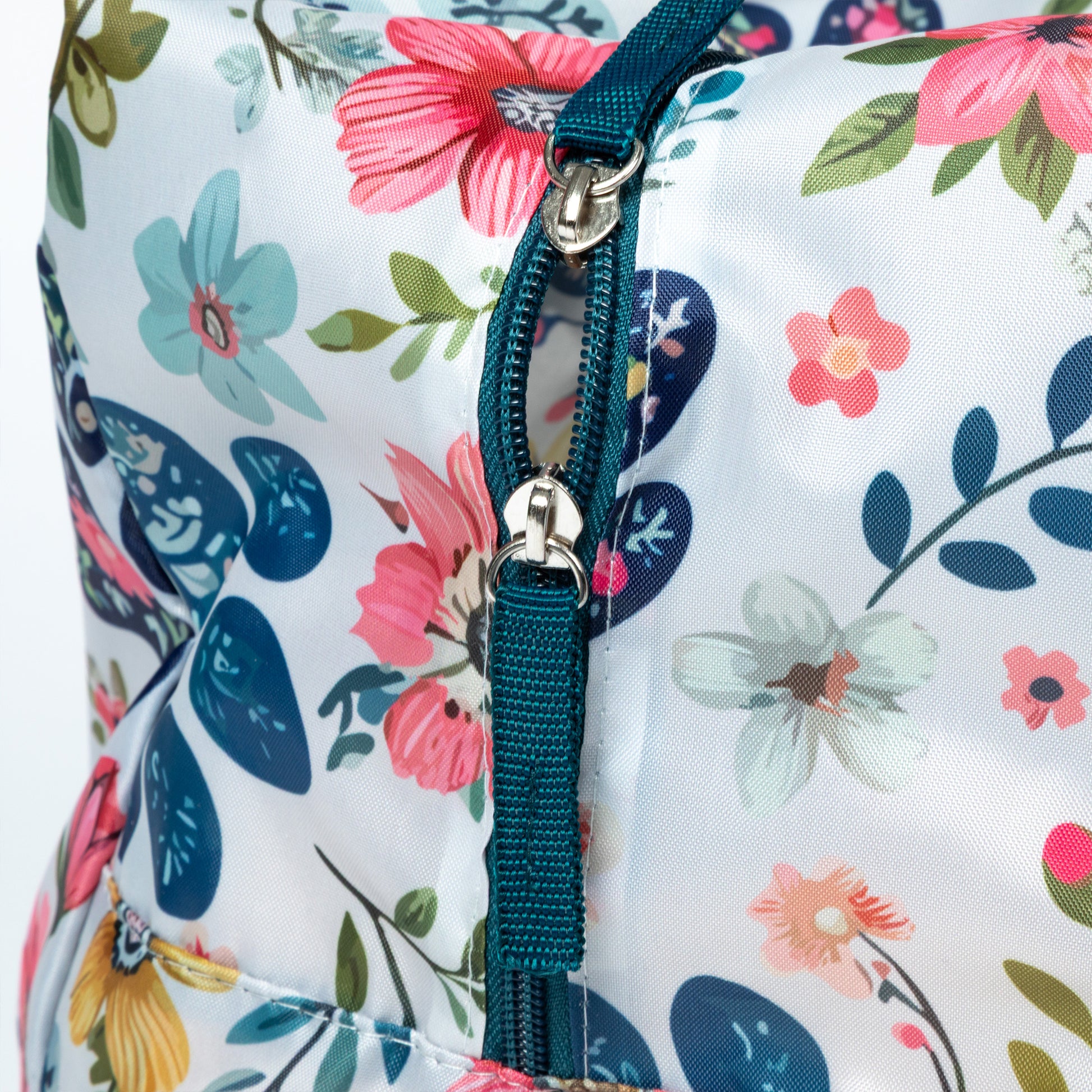 Floral-patterned bag with a zipper and strap