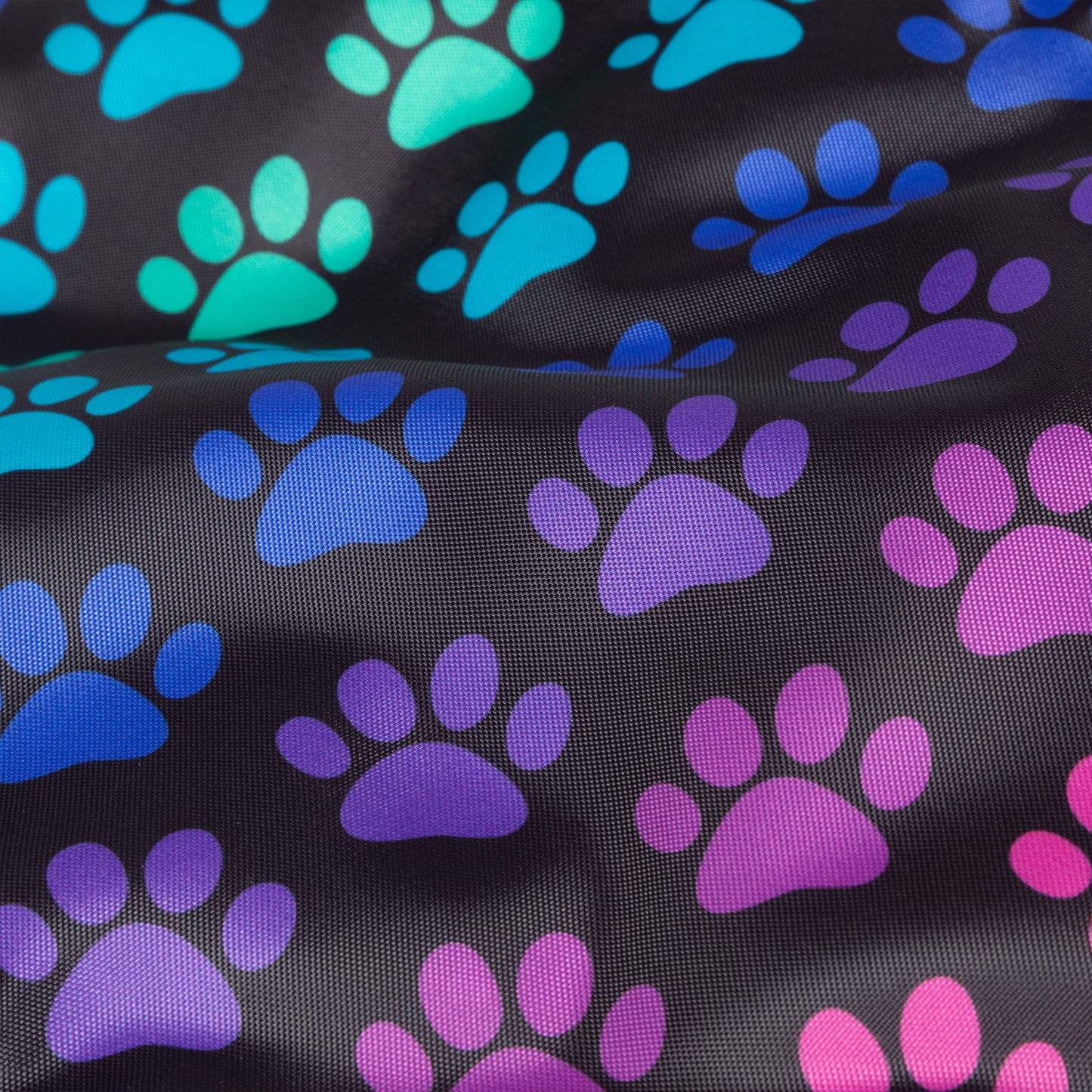 Black fabric with colorful paw prints in blue, green, purple, and pink.