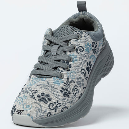 Gray sneaker with floral and paw print pattern on a white background